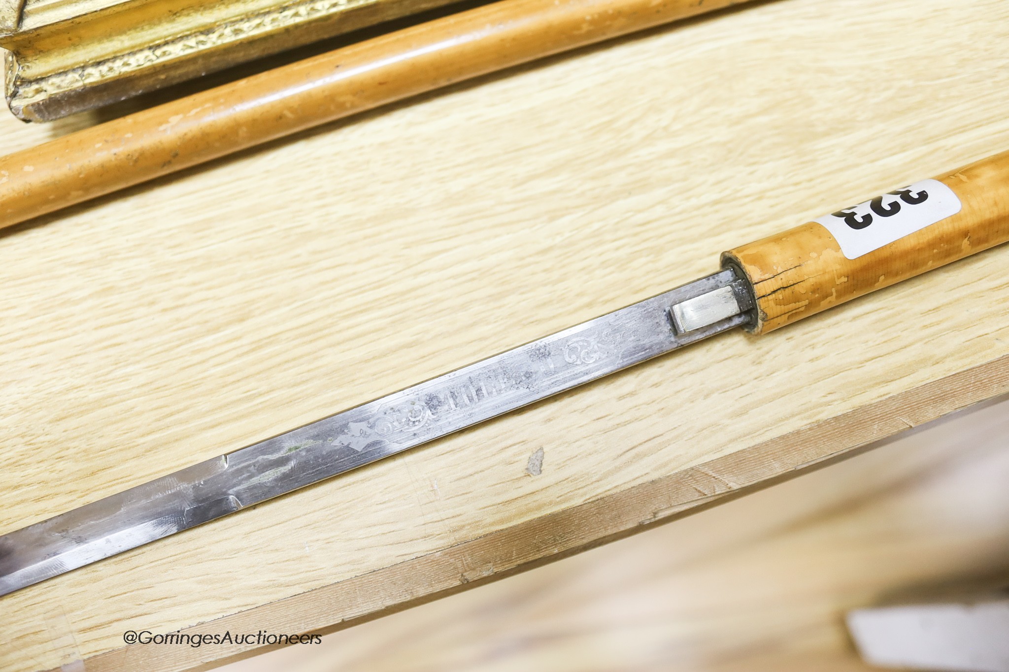 A Victorian silver mounted Malacca swordstick with engraved Toledo blade